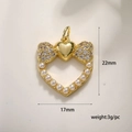 Detail view of a gold heart pendant with zircon bow and pearls measuring 22mm by 17mm - Pearl Bowknot