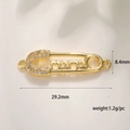Detail of 18K gold plated safety pin pendant with mama lettering and zircon stones - Pin MAMA
