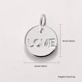 Macro detail of silver 'LOVE' engraved pendant with dimensions 9mm and 0.8g weight - Silver LOVE Design