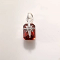 Macro view of a rectangular red crystal pendant with a silver star-shaped setting and bail - Silver Red A0210