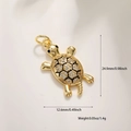 Macro detail of 14k gold-plated turtle pendant with sparkling zircon inlaid shell - Gold Tortoise
