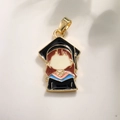 Golden girl graduate charm with black graduation gown and colorful enamel inlay - Female Doctor