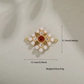 Detailed view of flower pendant with orange gem, white pearls and zircon accents - Gold Red Gemstone Cross Star (153)
