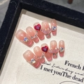Pink cat eye press-on nails with red heart rhinestones and pearl accents in frame - XS / Medium Coffin