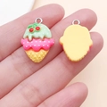 Close-up of resin cherry ice cream cone charms showing front and back details for DIY crafts - Yellow Green Cherry Cone Style (24479)