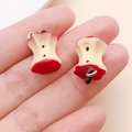 Macro view of handmade realistic red resin apple core pendants with metal loops - Red Resin Apple Core (19698)