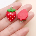 Detailed close-up of a resin strawberry pendant showing front and back with silver rings - Red Resin Strawberry (17064)