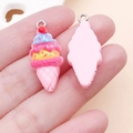Macro detail of resin strawberry ice cream cone charms with double-sided design and silver ring - Pink Ice Cream (24490)