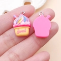 Detailed view of pink sweet resin cupcake charms with rainbow swirl and silver metal hooks - Creative Milkshake (24527) / Rose Base Yellow