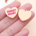 Detail of pink heart pendants with Sweet Heart text and silver loops for DIY crafts - Yellow Sweet Heart Style (24507)