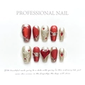 Detail of red press-on nails featuring heart-shaped rubies and gold embossed lines - Extra Small (XS) / New Year Armor