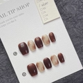Amber caramel press-on nails with marble swirl pattern on display card in short square oval - XS / Maillard Amber Gradient