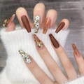 Unghie finte a ballerina color ambra marrone con farfalla 3D e strass - XS / Stile Maillard Invernale