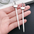 Detailed view of alloy sword pendants with silver plating and textured hilt detail - Antique Silver Rapier Sword (8077)