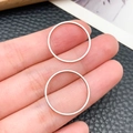 Detailed view of silver stainless steel minimalist thin circular rings for DIY jewelry - Round Style (T1872)
