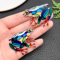 Hand holding acrylic frog pendants with colorful mosaic patterns for DIY jewelry making - Frog Style (23984) / 31x41x2mm