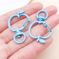 Light blue apple-shaped zinc alloy lobster clasp with matte finish and swivel ring - Blue