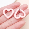 Handheld view of pink heart-shaped spring clasp for DIY jewelry and bag accessories - Light Pink