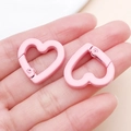 Detail of pink matte heart-shaped spring clasps for DIY jewelry and bag charms - Pink