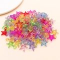 Macro shot of colorful transparent acrylic star charms for DIY jewelry making - 21x16.5mm