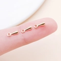 Macro view of small gold water drop pendants held on fingers for DIY jewelry size scale - 7x2.5mm / KC Gold