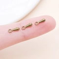 Macro shot of three vintage bronze teardrop charms for DIY jewelry making - 7x2.5mm / Antique Bronze