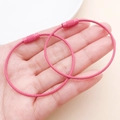 Pink coated wire keychains with knurled screw connector held in hand for detail - Rose Red