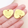 Golden heart-shaped metal pendant with Mozto Hiano engraving and matte finish texture - 21x23mm / Yellow