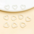 Detailed view of hollow heart-shaped pearl beads for DIY crafts and nail art designs - Hollow Heart (25777) / 10x10mm