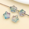 Macro shot of colorful glass star beads with gold foil inside for DIY jewelry making - Frosted Blue Purple Gradient Gold Foil