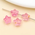 Macro shot of pink star glass beads with gold foil inlay for DIY jewelry making - Frosted Rose Red Gold Foil