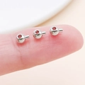 Close-up of small silver metal round jewelry clasp crimp beads with inner tube for DIY jewelry - Round White K (25904)