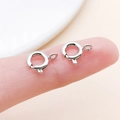 Detailed macro view of small 6mm silver spring ring clasps for jewelry making - White K (25918)