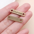 Antike Bronze-Verbinder mit Courage-Gravur und Doppellöchern für DIY-Schmuck - COURAGE Buchstaben (5657)