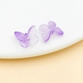 Detailed macro view of purple gradient butterfly glass beads for handmade jewelry - Transparent Purple
