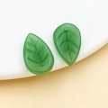 Detail of green leaf-shaped glass charms with golden veins for DIY hair jewelry making - Jelly Dark Green (26845)