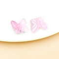 Macro detail of pair of pink gradient glass butterfly charms for DIY jewelry making - Transparent Light Pink