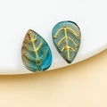 Macro detail of leaf-shaped glass beads with intricate gold-painted veins for jewelry DIY - Transparent Orange Yellow Blue Gradient Gold Veined (26685)