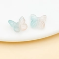 Macro shot of translucent gradient butterfly beads for DIY jewelry and hair accessories - Transparent Blue Pink Gradient
