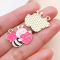 Detail of pink enamel bee charm with LOVE heart and textured gold-tone alloy backing - love Heart Bee (27206)