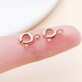 Pair of rose gold spring ring clasps for jewelry making held on a fingertip - 6mm / Rose Gold (25909)