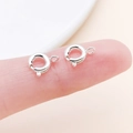 Polished silver spring ring clasps for DIY jewelry making on fingertip reference - Bright Silver (25910)
