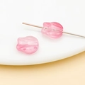 Detailed macro view of pink tulip-shaped glass beads with central hole for DIY jewelry making - Transparent Pink Tulip (26709)