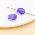 Macro shot of tulip-shaped glass beads in purple-blue gradient with center hole detail - Transparent Blue-Purple Gradient Tulip (26708)