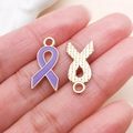 Macro shot of purple enamel ribbon pendants with gold trim for DIY jewelry making - Bowtie Style (24870)
