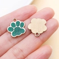 Macro detail of green glitter cat paw charms with golden textured metal back for DIY crafts - Cute Cat Paw Pendant (23318)