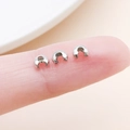 Silver Crimp Bead Covers made of copper for DIY jewelry making shown on fingertips - Small White K (25584)