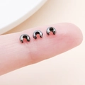 Gun black copper C-shape bead covers for jewelry making shown on fingertip - Small Gun Black (25587)