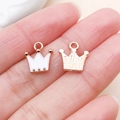 DIY crown pendant in rose gold with white enamel detail shown on fingertip - Crown Style (11024)