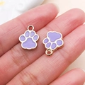 Set of two purple enamel paw print pendants with golden metal frames for DIY jewelry - Cat Paw Style (23311)